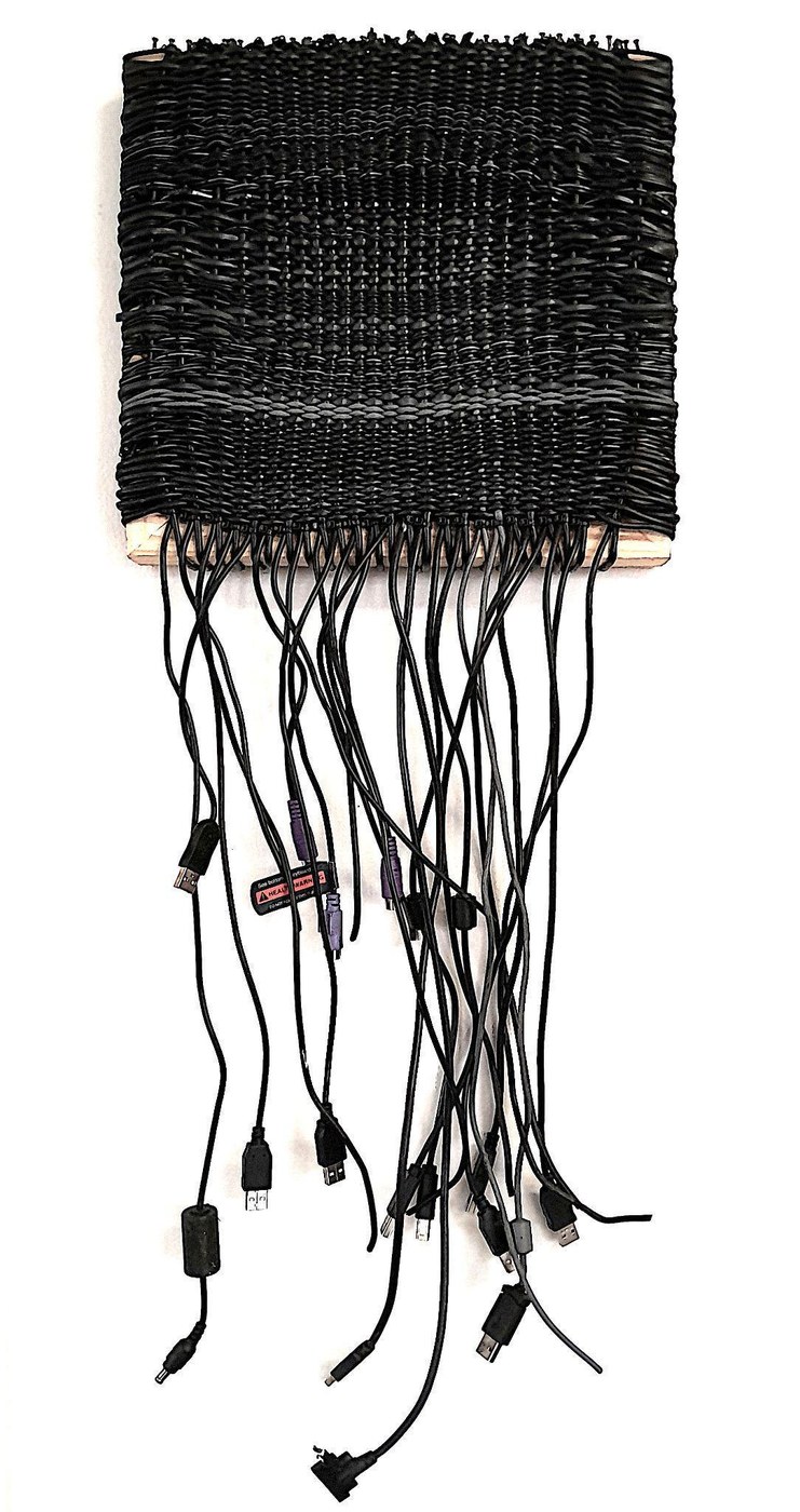Maurice Mbikayi work: a woven wall panel of computer cables, part of the Fractal Series