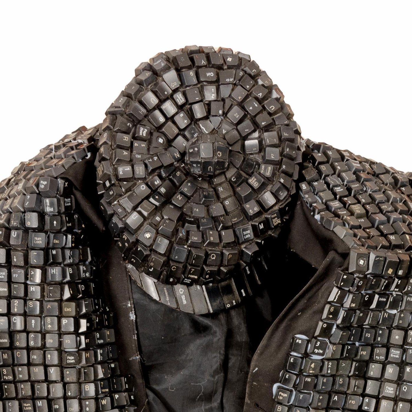 Maurice Mbikayi wearable sculpture: Techno Hat, a hat assembled from computer keys, worn during performance