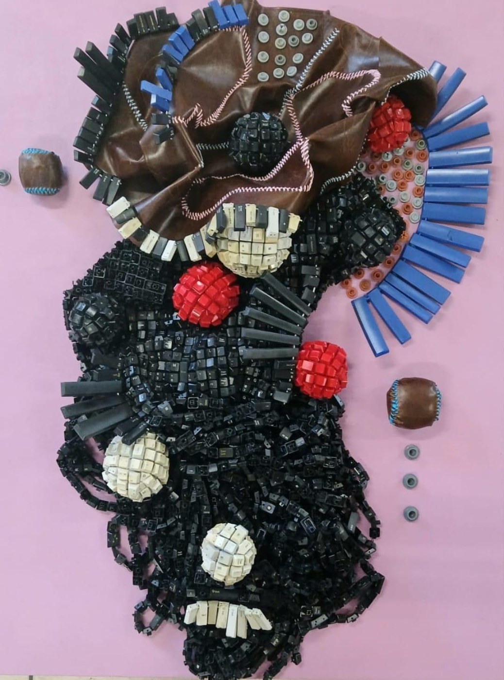 Maurice Mbikayi mixed-media work: Digital DNA 1, leather and computer keys on canvas