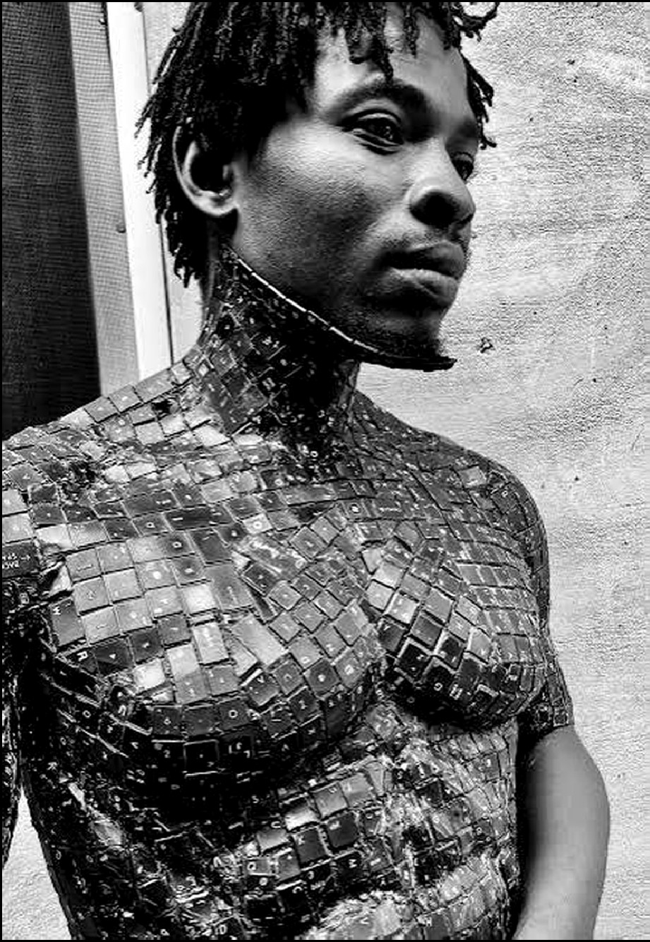 Ozuma Patrick Chidiebube, portrait, wearing a covering assembled from keyboard keys