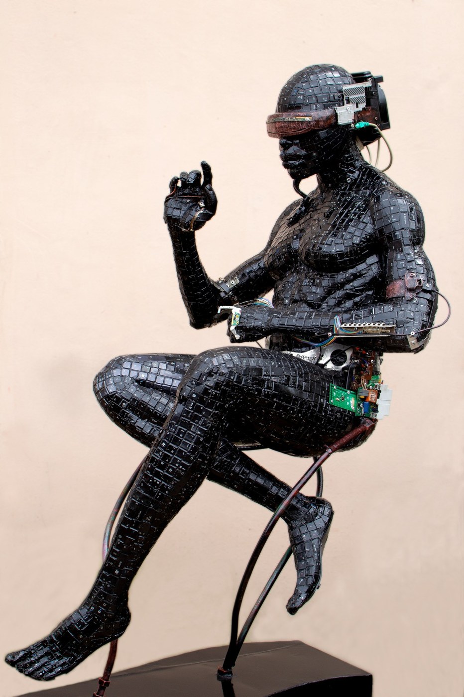 Ozuma Patrick Chidiebube sculpture: Metaverse of the Mind, a seated figure made from recycled computer keyboards