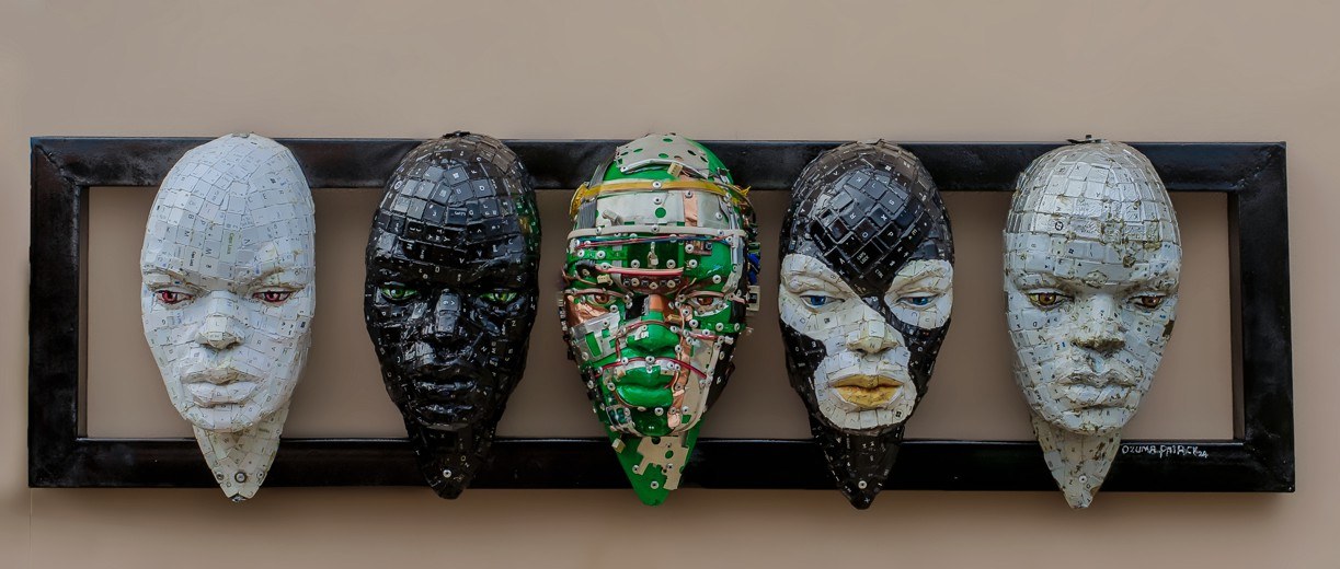 Ozuma Patrick Chidiebube sculpture: Beyond the Looks, five keyboard-key masks mounted in a single frame
